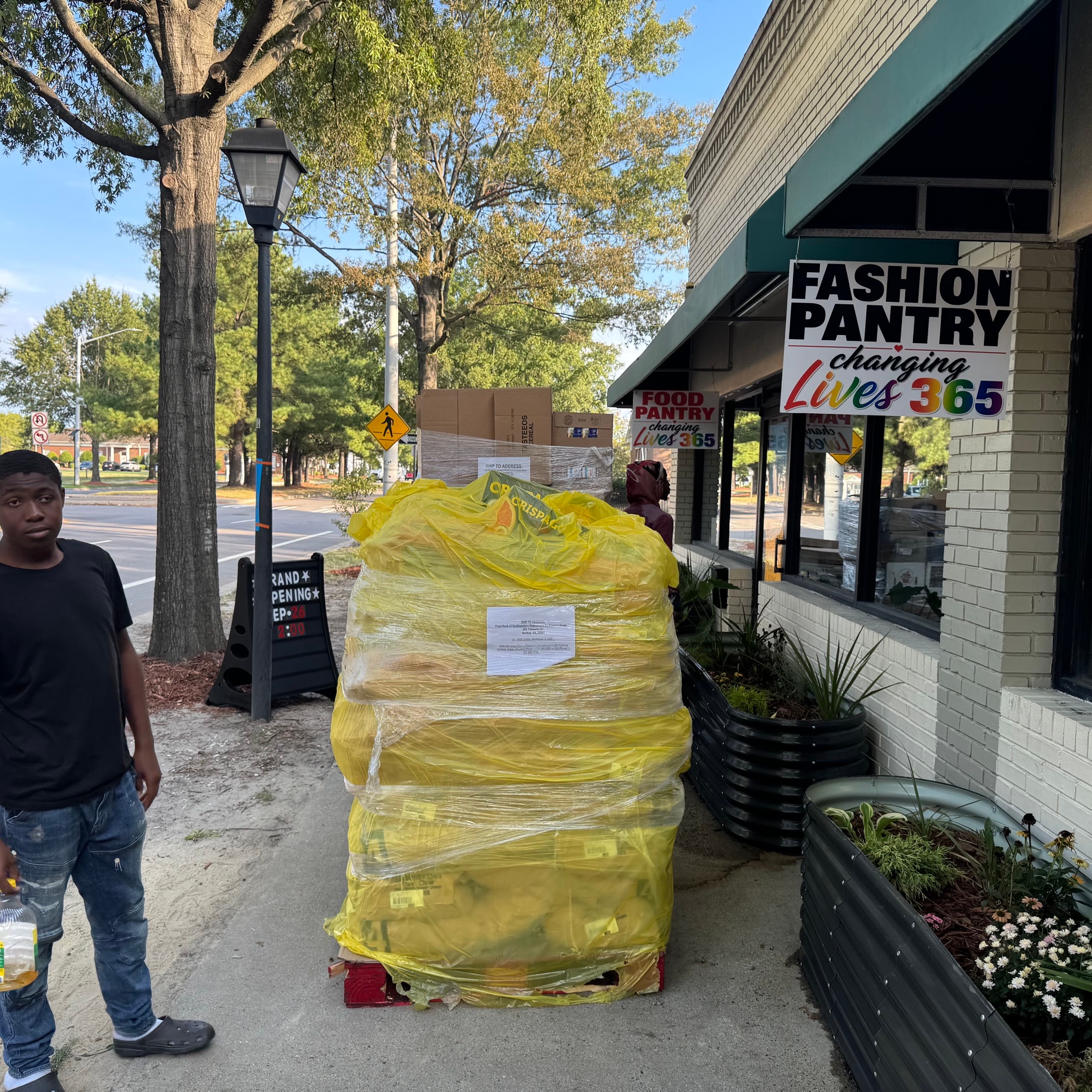 Fashion Pantry storefront with Changing Lives 365 signage