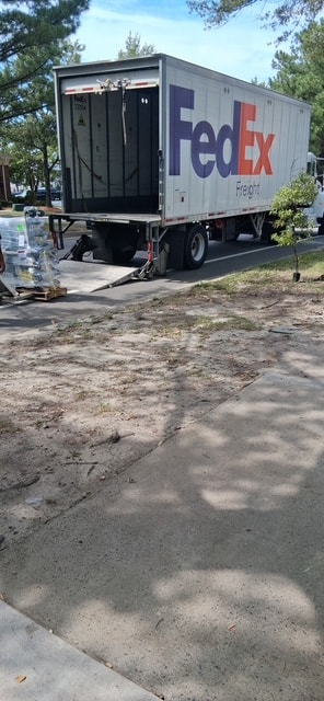 FedEx freight truck delivering supplies to Changing Lives 365